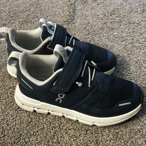 On Running Black and White Sneakers with Cushioned Design